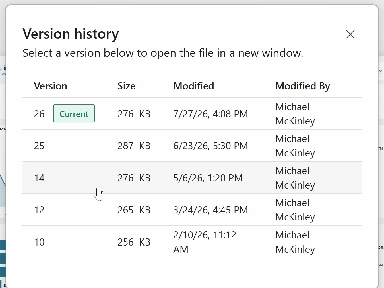 The Version history dialog after the restore. Version 26, tagged Current, is 276 KB; below it are version 25 at 287 KB, version 14 at 276 KB, version 12 at 265 KB and version 10 at 256 KB, all modified by Michael McKinley.